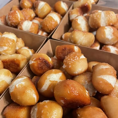 Soft pretzel bites in kraft boxes with coarse salt